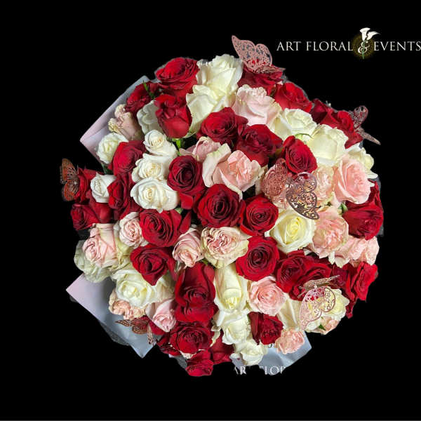 Bouquet of red, white, and blush roses with butterfly accents