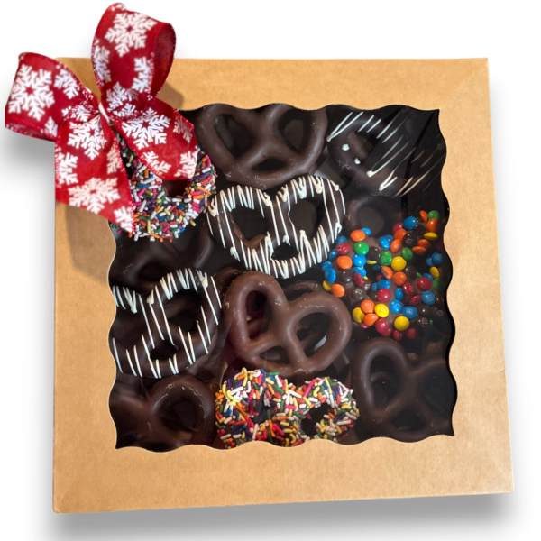 Box of chocolate-covered pretzels with a red ribbon bow