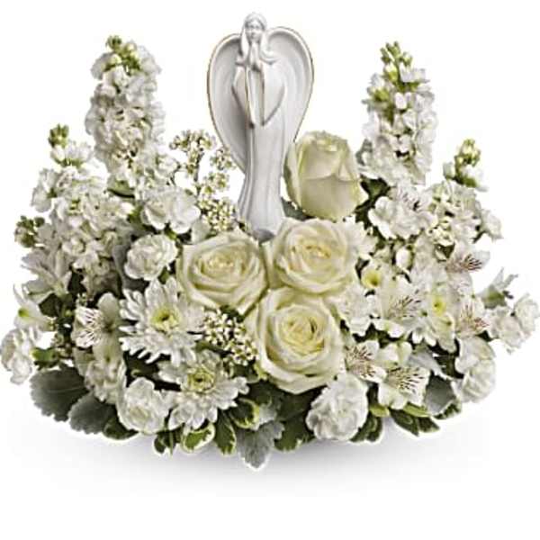 White floral arrangement with roses and a silver angel figurine