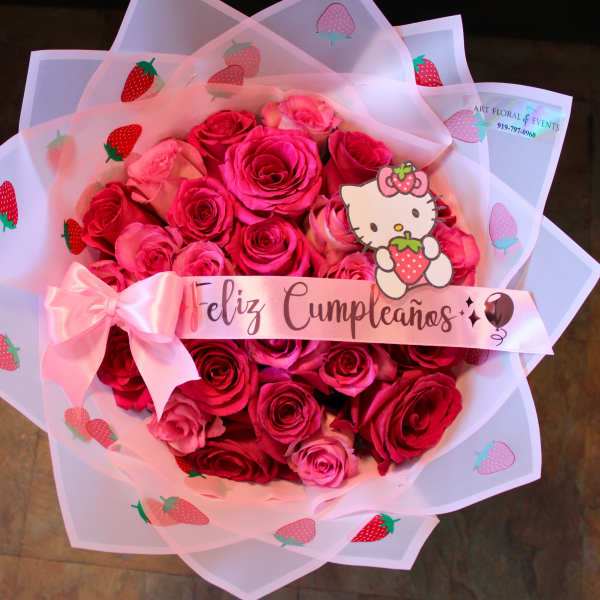 Pink rose bouquet wrapped in strawberry-printed paper with a birthday ribbon