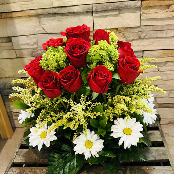 Bouquet of red roses and white daisies with yellow filler flowers