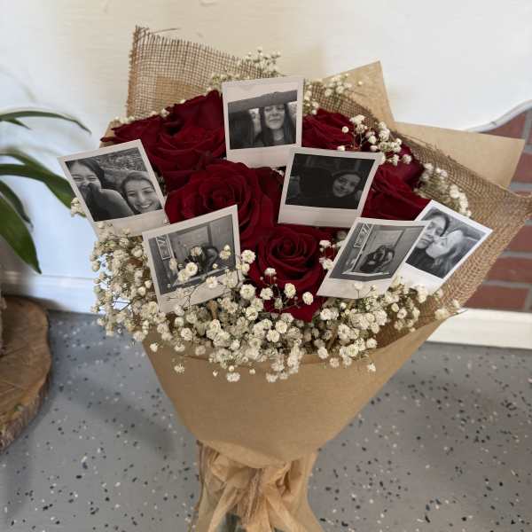 Bouquet of red roses with baby’s breath and photo prints