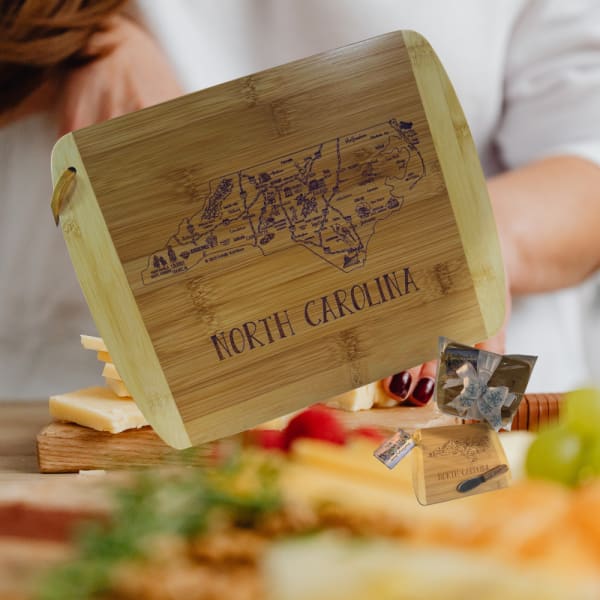 Wooden cheese board engraved with North Carolina map and text