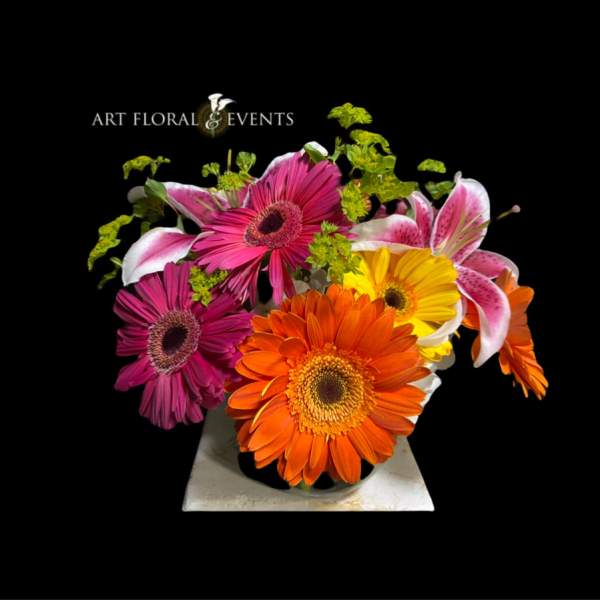 Bright gerbera and lily bouquet in a vase