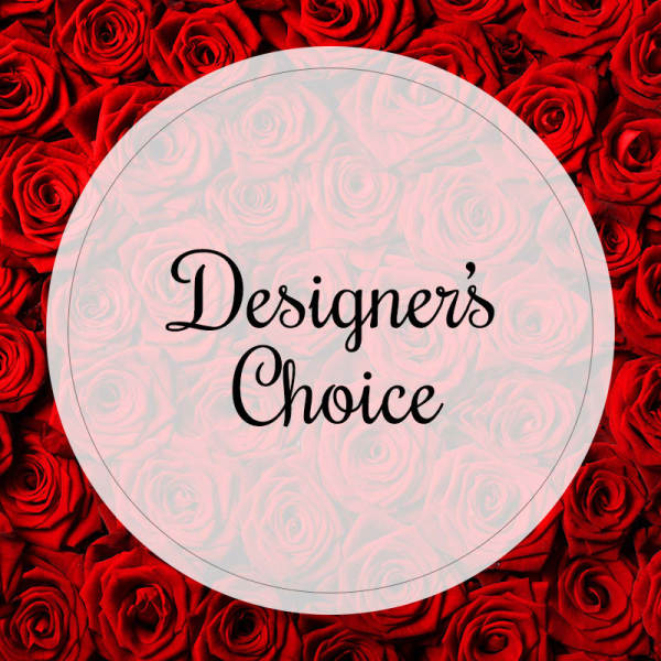 Red roses with a circular label reading "Designer’s Choice"