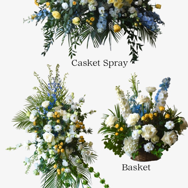 Floral casket spray, standing spray, and basket arrangement in white, yellow, and blue