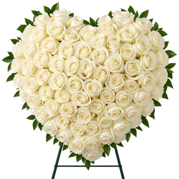 Heart-shaped arrangement of white roses on a stand