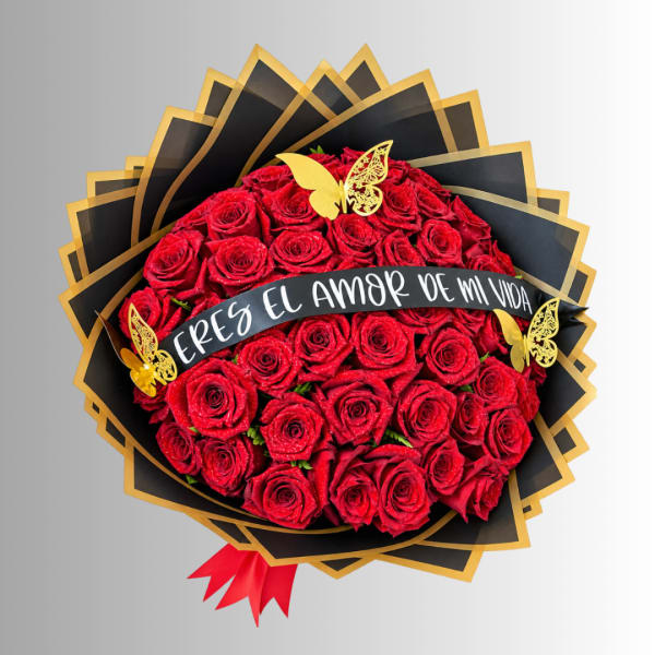 Bouquet of red roses with a black and gold wrap and a Spanish banner