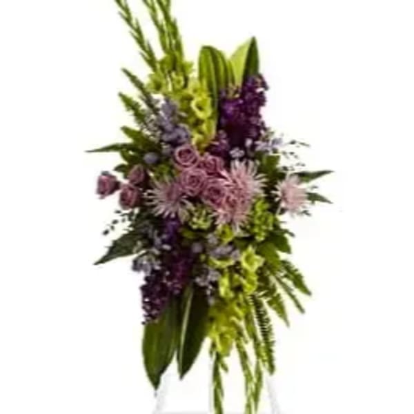 Tall floral spray with purple and green flowers on a stand