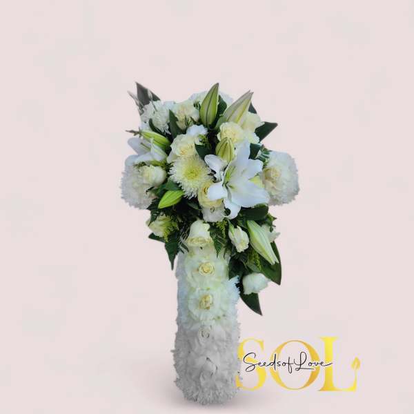 White floral standing spray with lilies and roses