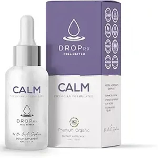 White dropper bottle beside a purple product box