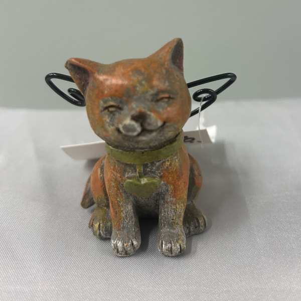 Small cat figurine with wire wings and a collar