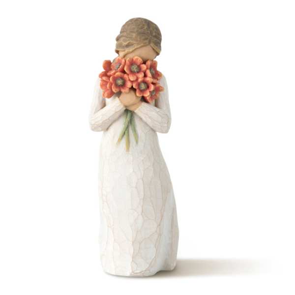 Figurine of a girl holding an orange flower bouquet