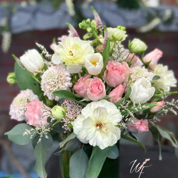 Pink and white mixed bouquet in a glass vase