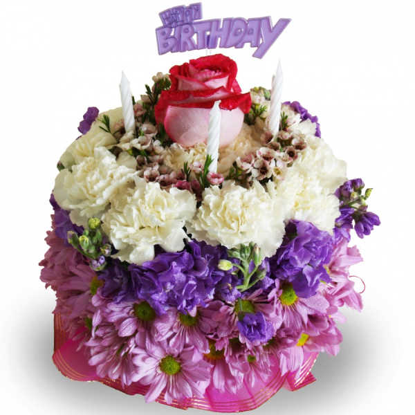 Birthday cake-shaped floral arrangement with purple and pink flowers
