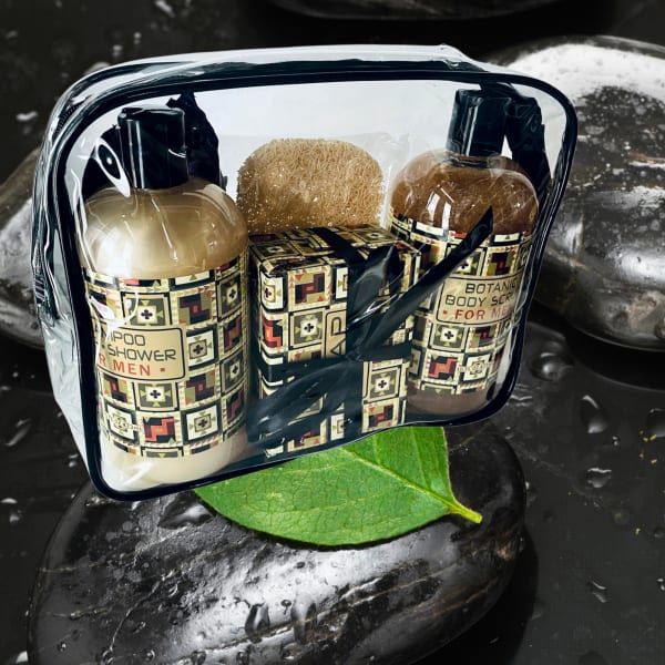 Men's shower gift set with shampoo, body scrub, and sponge in a clear pouch