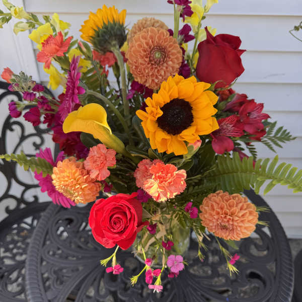 Mixed bouquet with roses, sunflowers, dahlias, and calla lilies