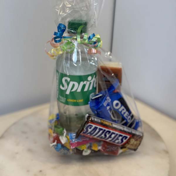 Gift bag with a Sprite bottle and assorted candy bars wrapped in clear cellophane