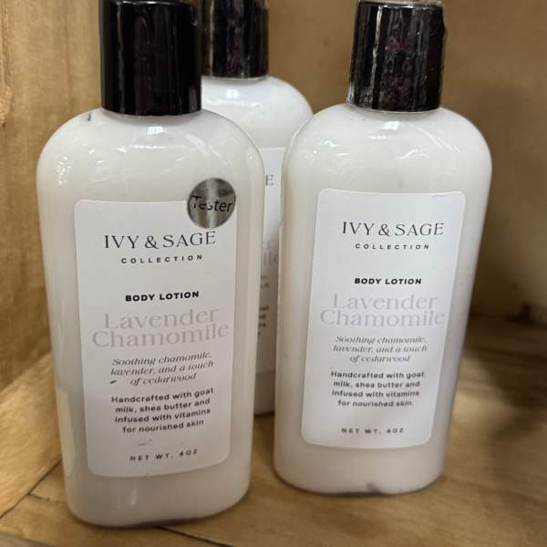 Three bottles of Ivy & Sage lavender chamomile body lotion on a shelf