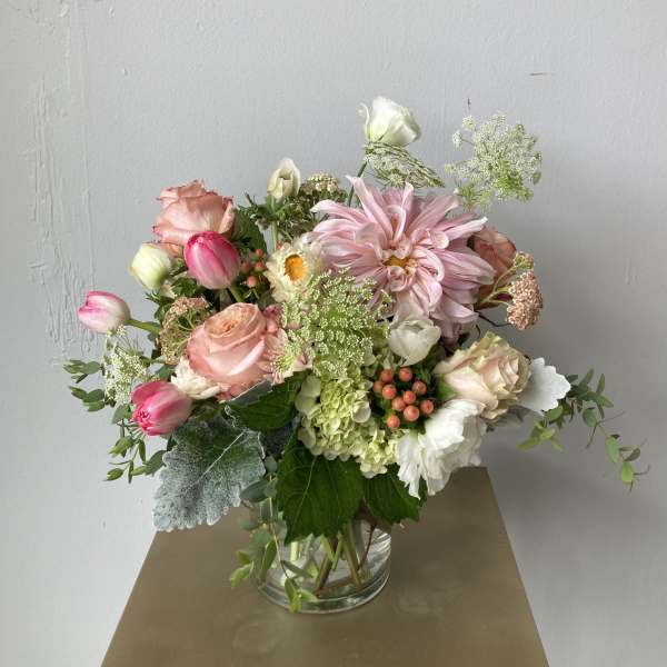 Pink and white mixed bouquet in a clear glass vase