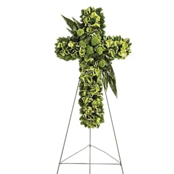 Green floral cross on a metal stand