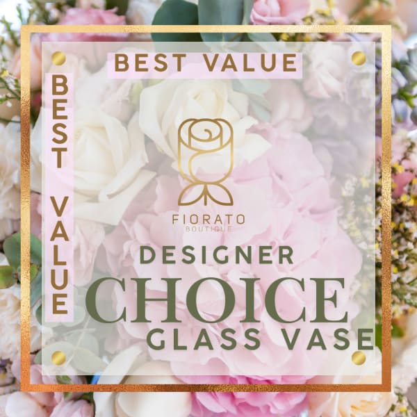 Designer choice bouquet in a glass vase with pink and white flowers