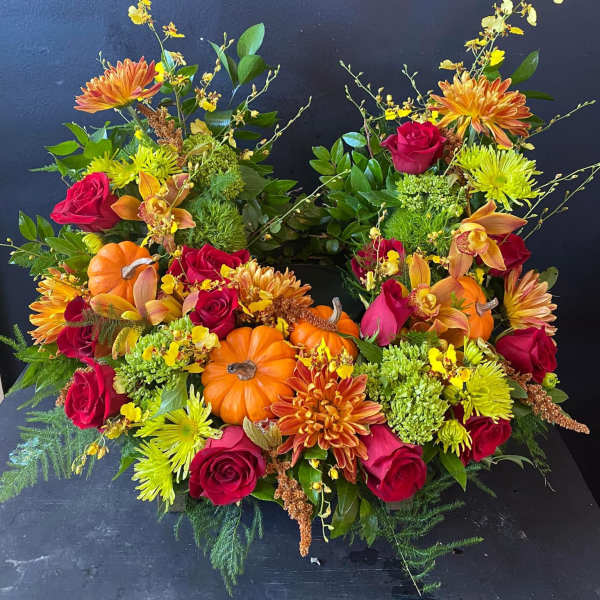 Two autumn floral arrangements with pumpkins and roses