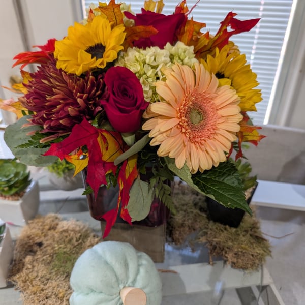 Autumn bouquet with sunflowers, roses, gerbera daisies, and mums