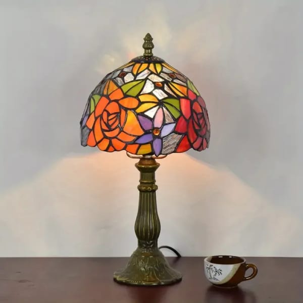Stained-glass table lamp with a floral mosaic shade