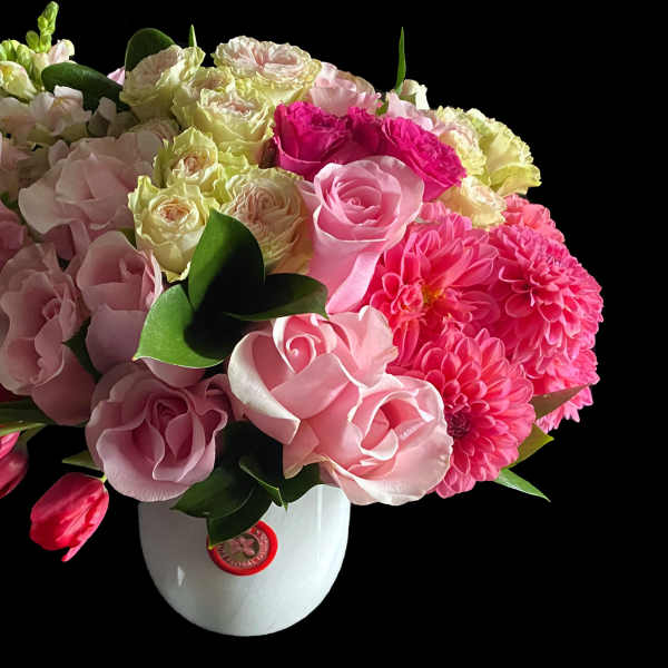 Pink and white mixed bouquet in a white vase