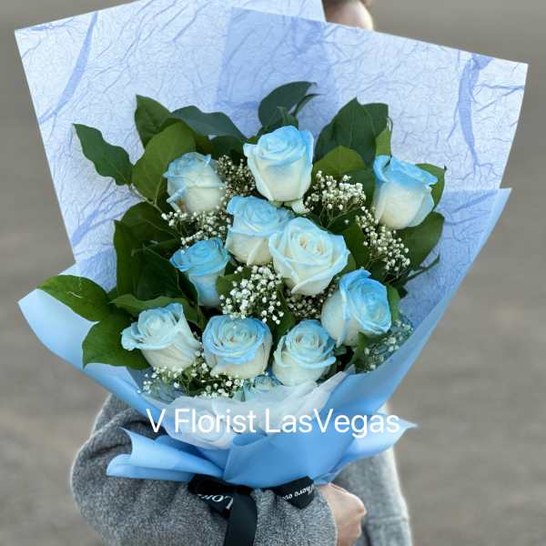 Bouquet of light blue and white roses with baby's breath