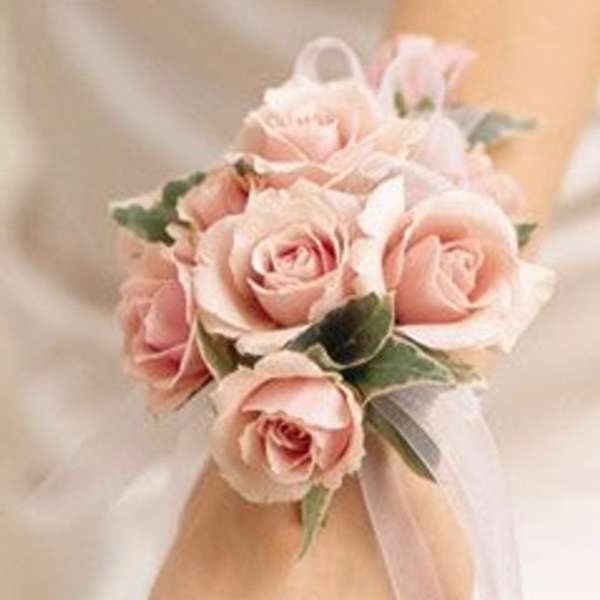 Pink rose wrist corsage with ribbon ties
