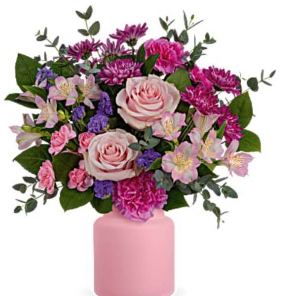 Pink and purple flower arrangement in a pink vase