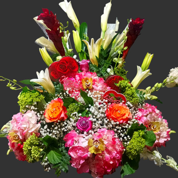 Colorful mixed bouquet with roses, lilies, and hydrangeas