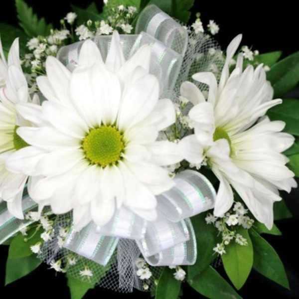 White daisy bouquet with a silver ribbon and green accents