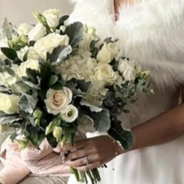 White bridal bouquet with roses and hydrangeas