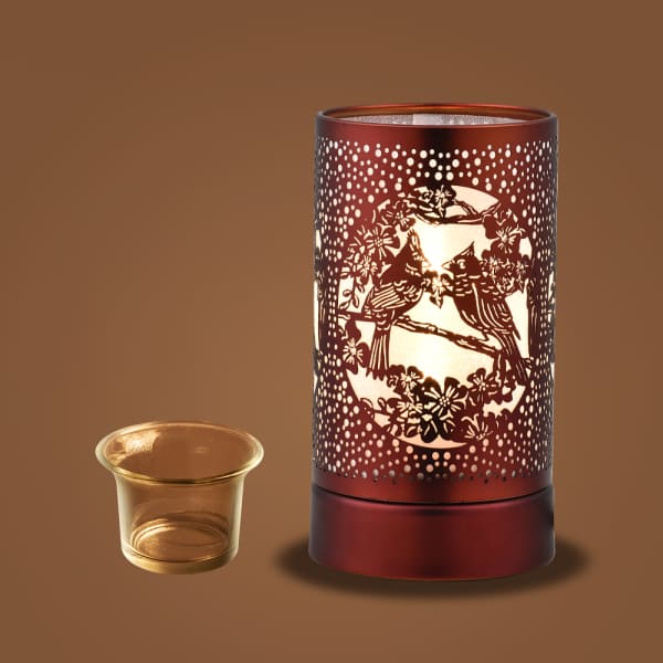Decorative red candle warmer with a glass tealight holder