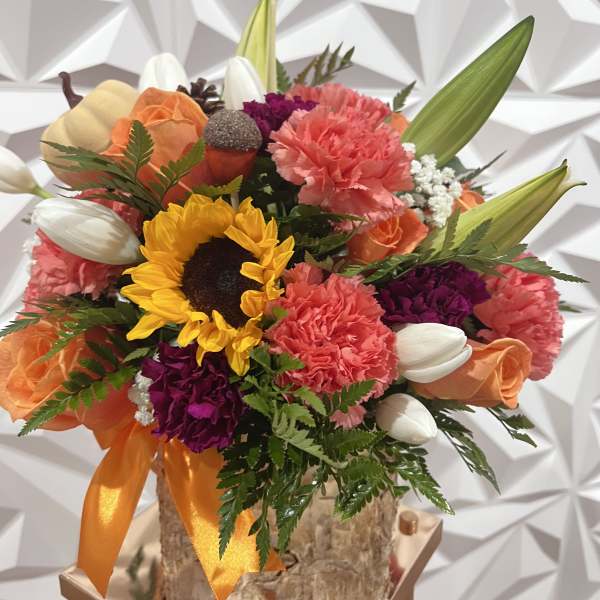 Colorful bouquet with sunflowers, carnations, roses, and tulips