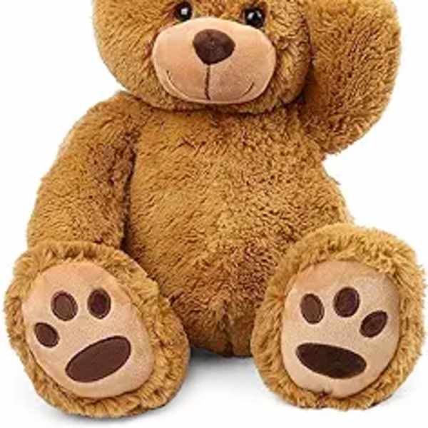Brown teddy bear plush toy sitting with one paw raised