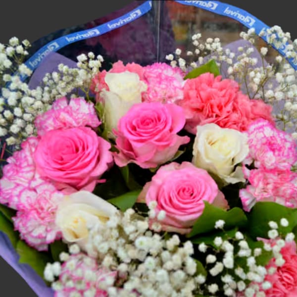 Bouquet of pink and white roses with carnations and baby's breath