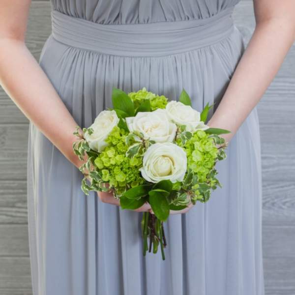 Bridal bouquet of white roses and green hydrangeas