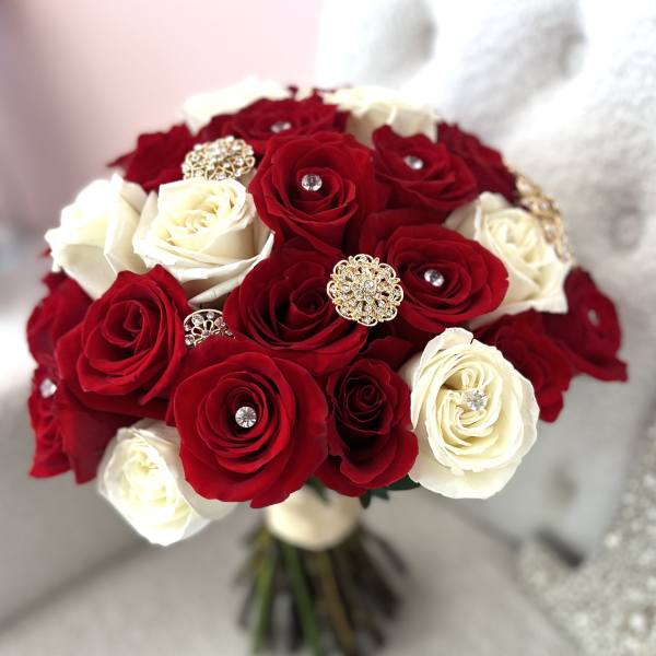 Bouquet of red and white roses with jeweled accents