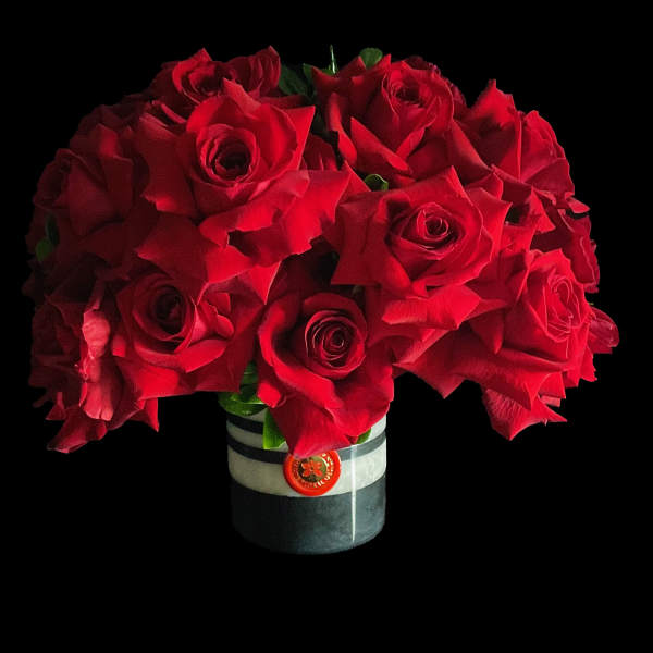 Bouquet of red roses in a striped vase