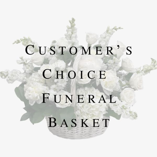 White funeral basket arrangement with roses and snapdragons
