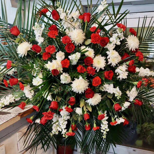 Large red and white floral spray with roses and carnations