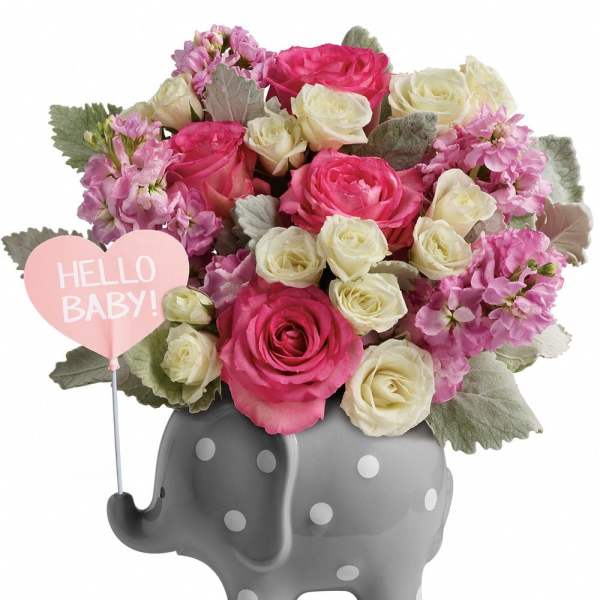 Pink and white rose bouquet in a gray elephant vase with a "Hello Baby!" sign