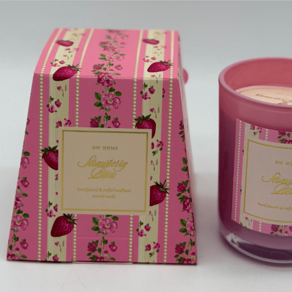 Pink strawberry-scented candle in a glass jar beside matching box