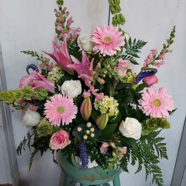 Pink and white mixed flower arrangement in a vase