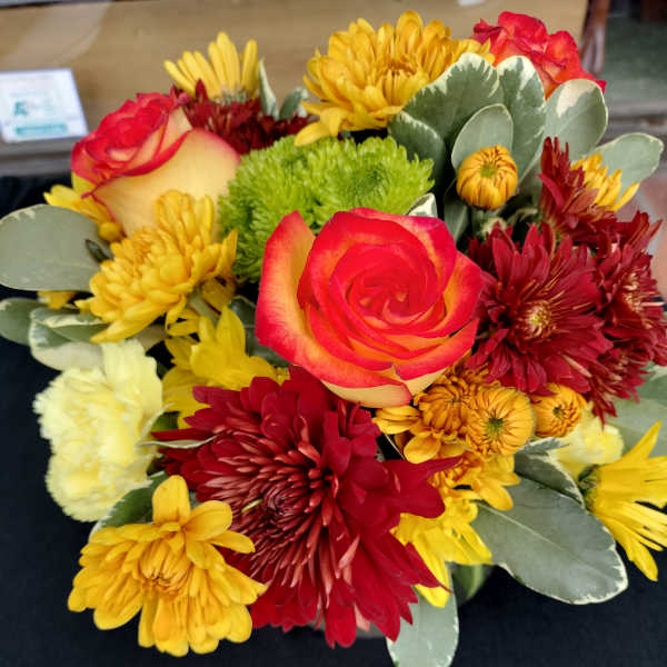 Mixed bouquet with red and yellow roses and chrysanthemums