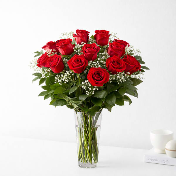 Bouquet of red roses in a clear glass vase